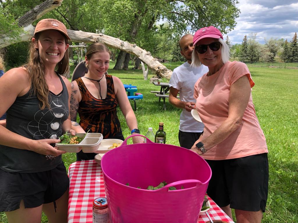 Group of people enjoying outdoor meal at Polestar Village.