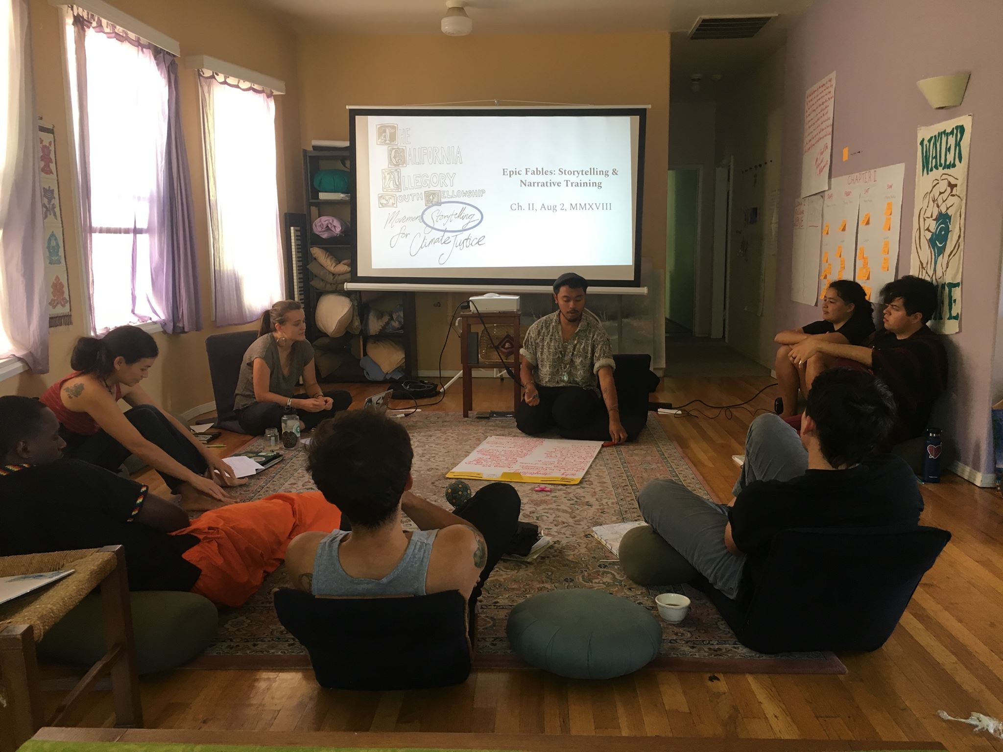 Group of people attending a community workshop at Canticle Farm.