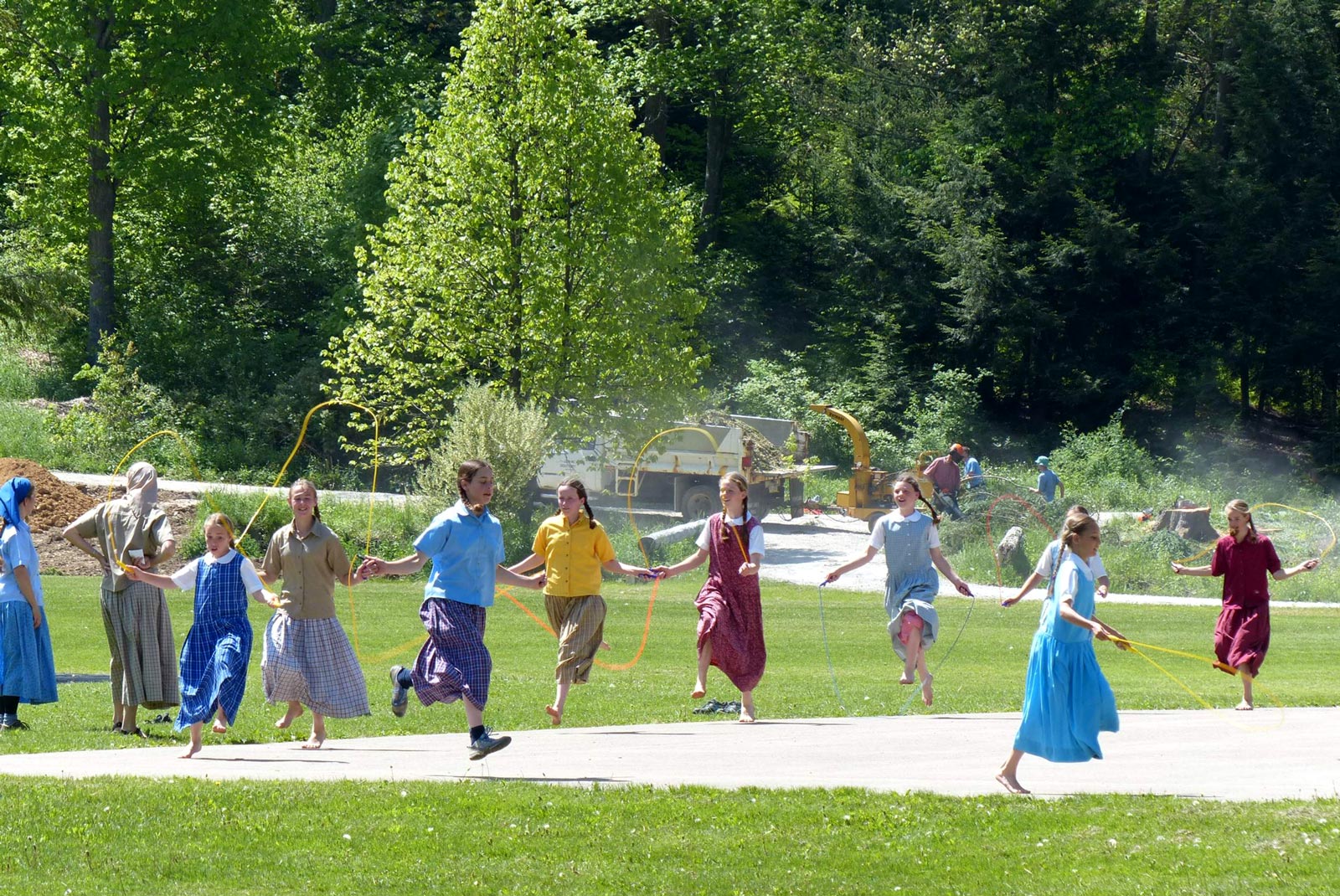 Children playing with jump ropes at New Meadow Run Bruderhof community.