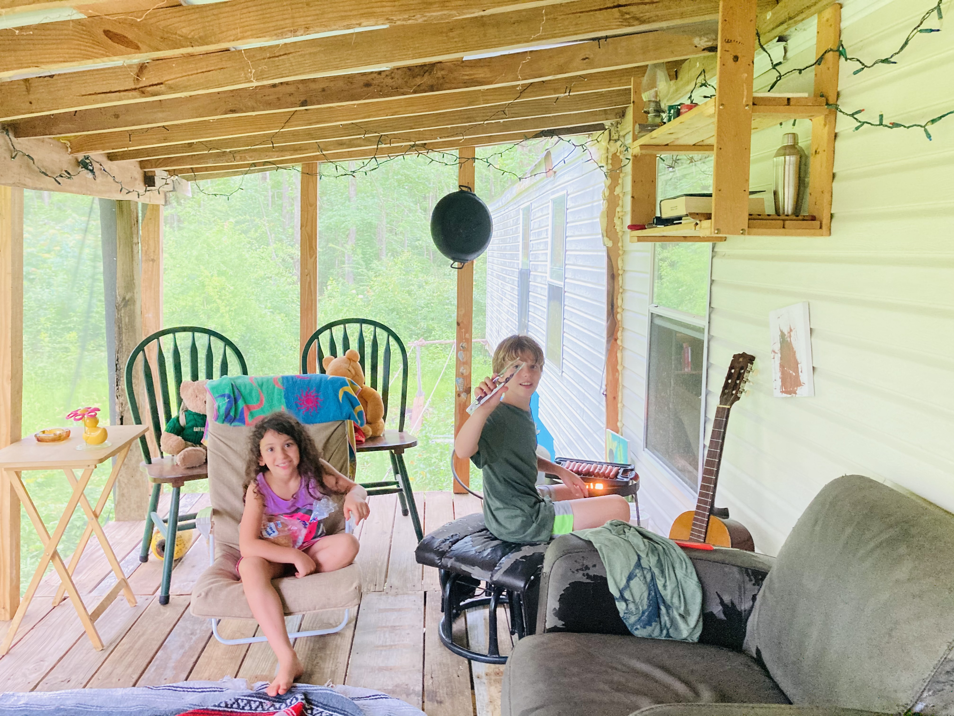 Community members enjoying a cozy porch at Aurora eco village.