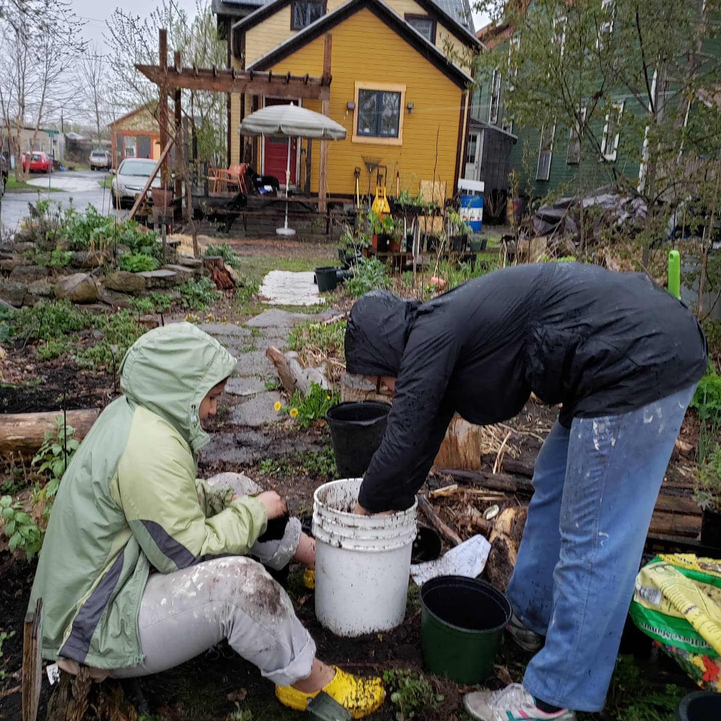People working together in a community garden at Bitternut Homestead.