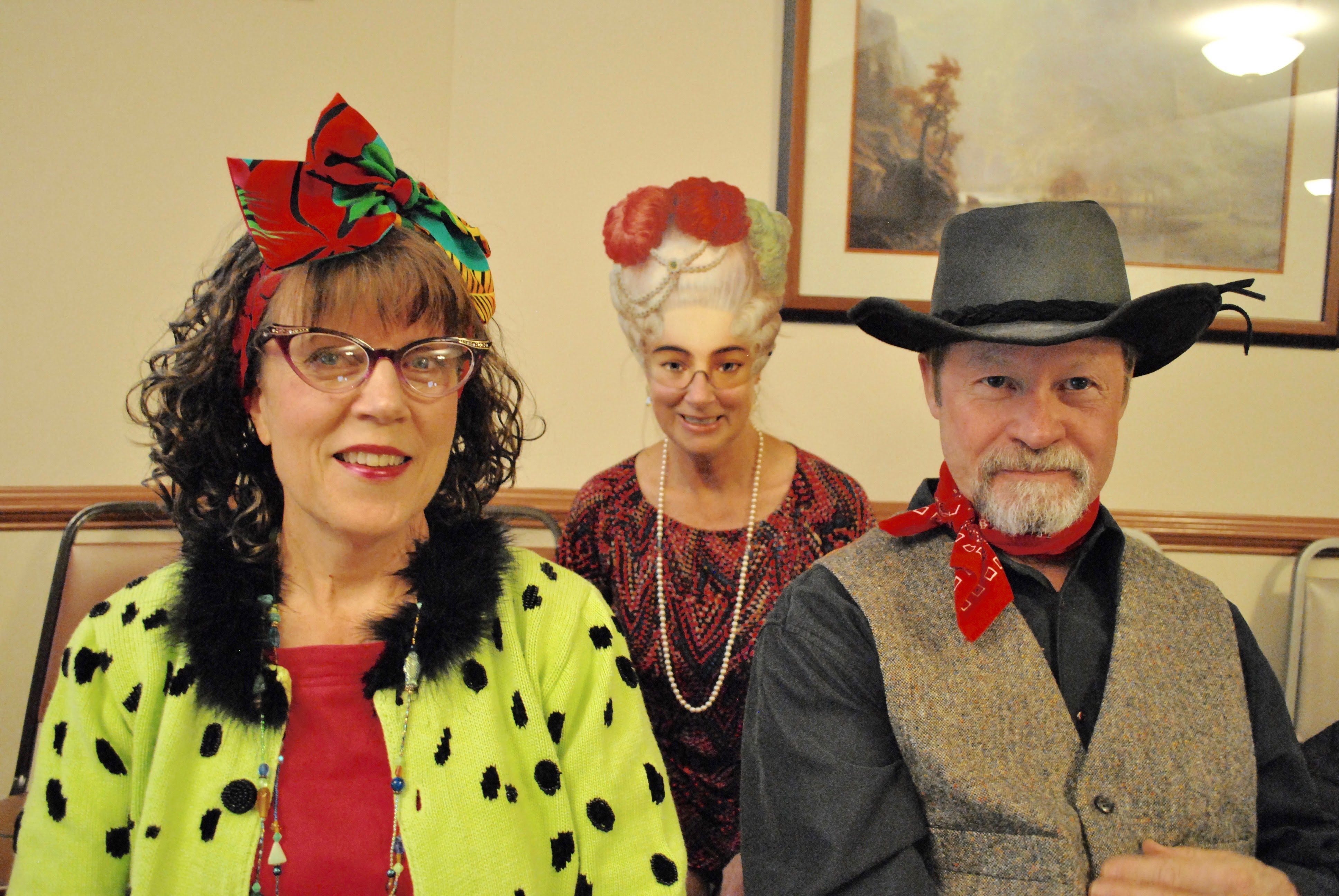 Three people in vintage and quirky costumes at Adawehi Wellness Village.