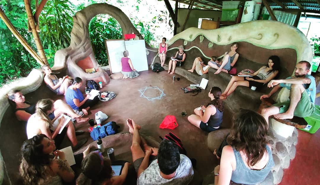 Group of people participating in a community workshop at Rancho Mastatal.
