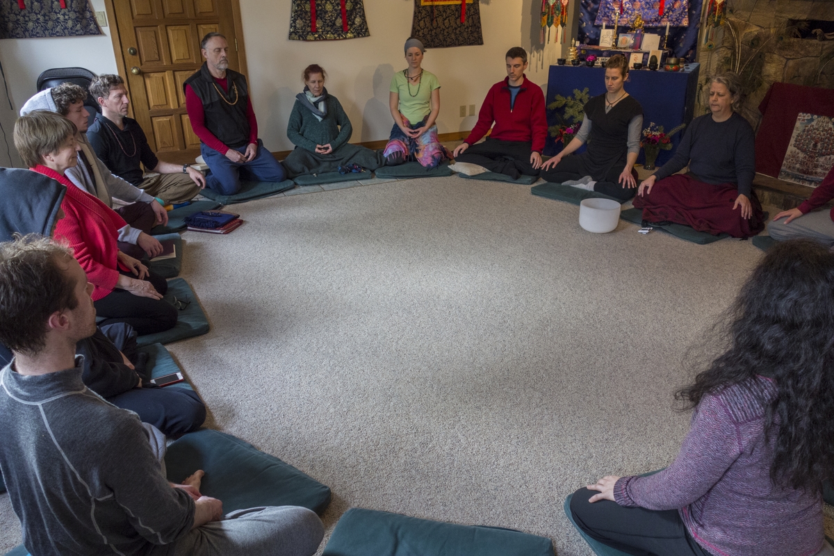 People sitting in a circle during meditation at Clear Sky Meditation and Retreat Center.