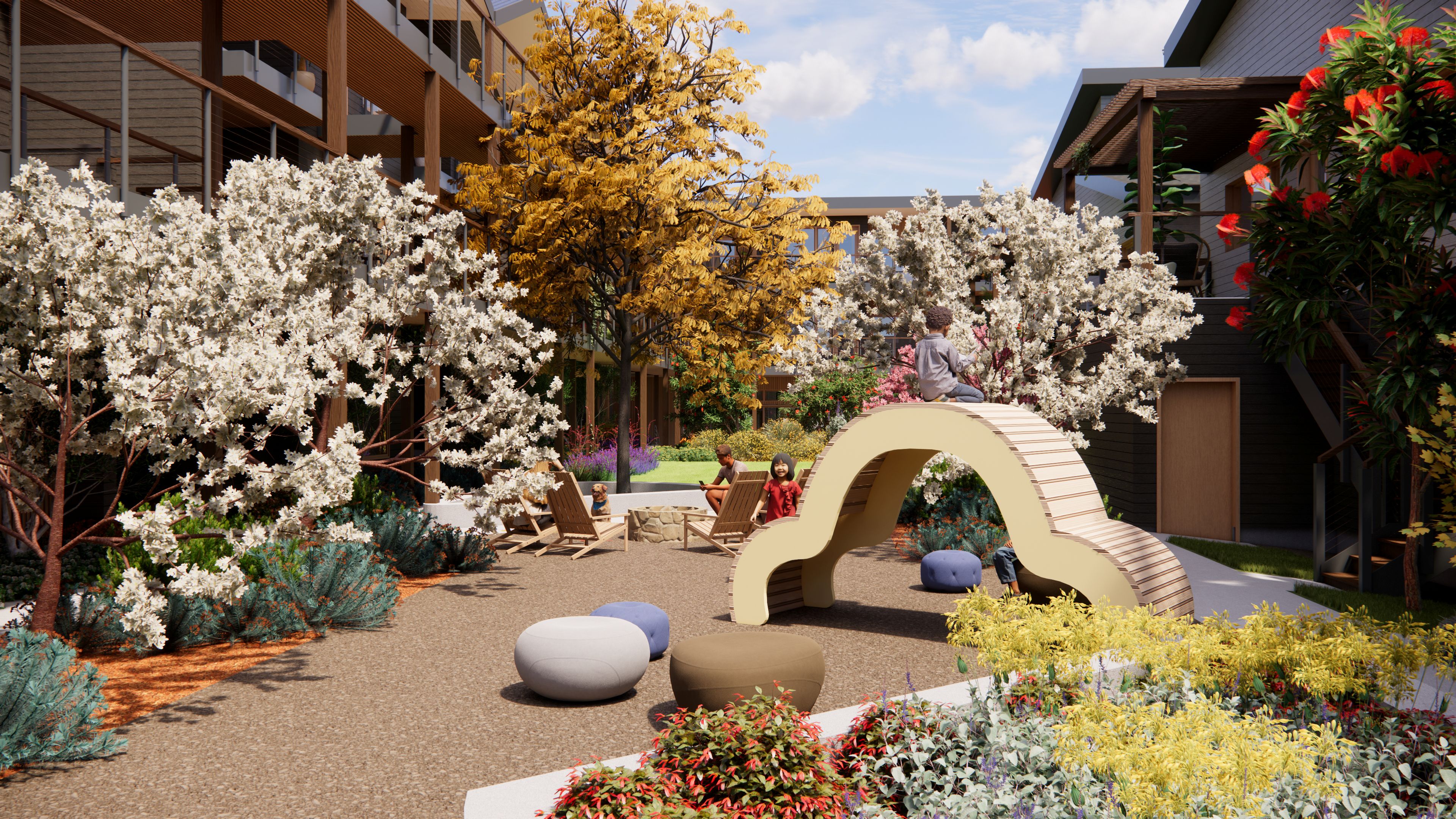 Shared outdoor space with trees, seating, and play area at Blue Columbine Cohousing.