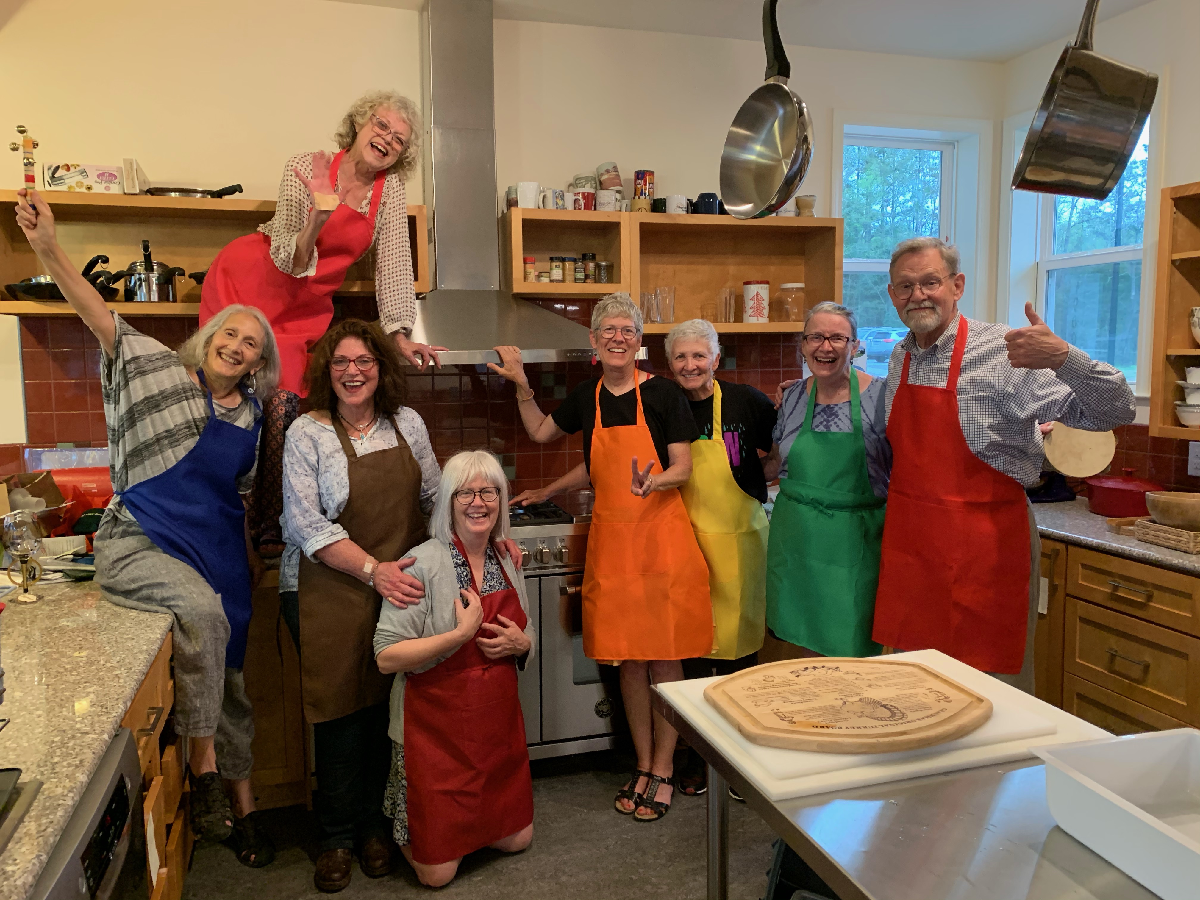Group of diverse people cooking together in a community kitchen.