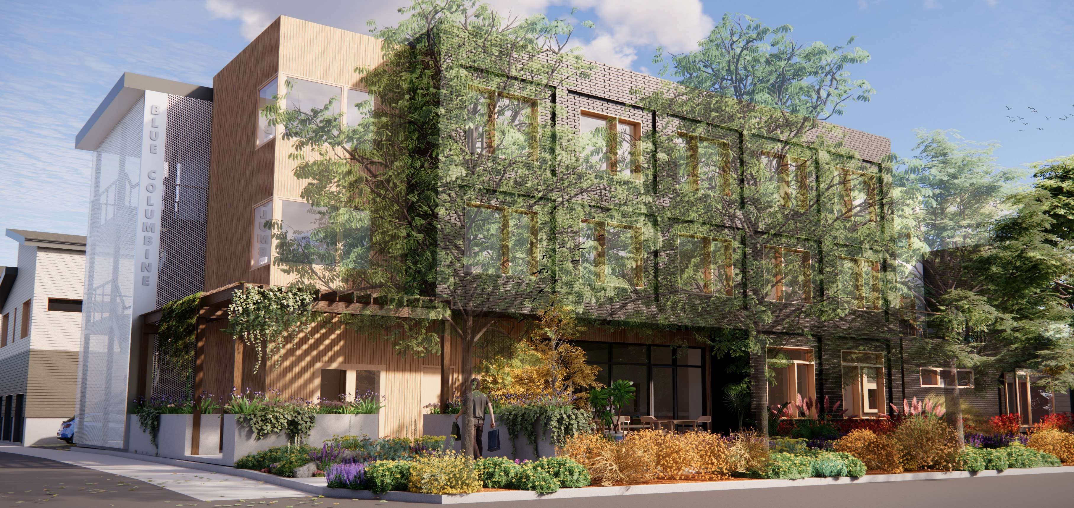 Modern community building with green trees and landscaping.