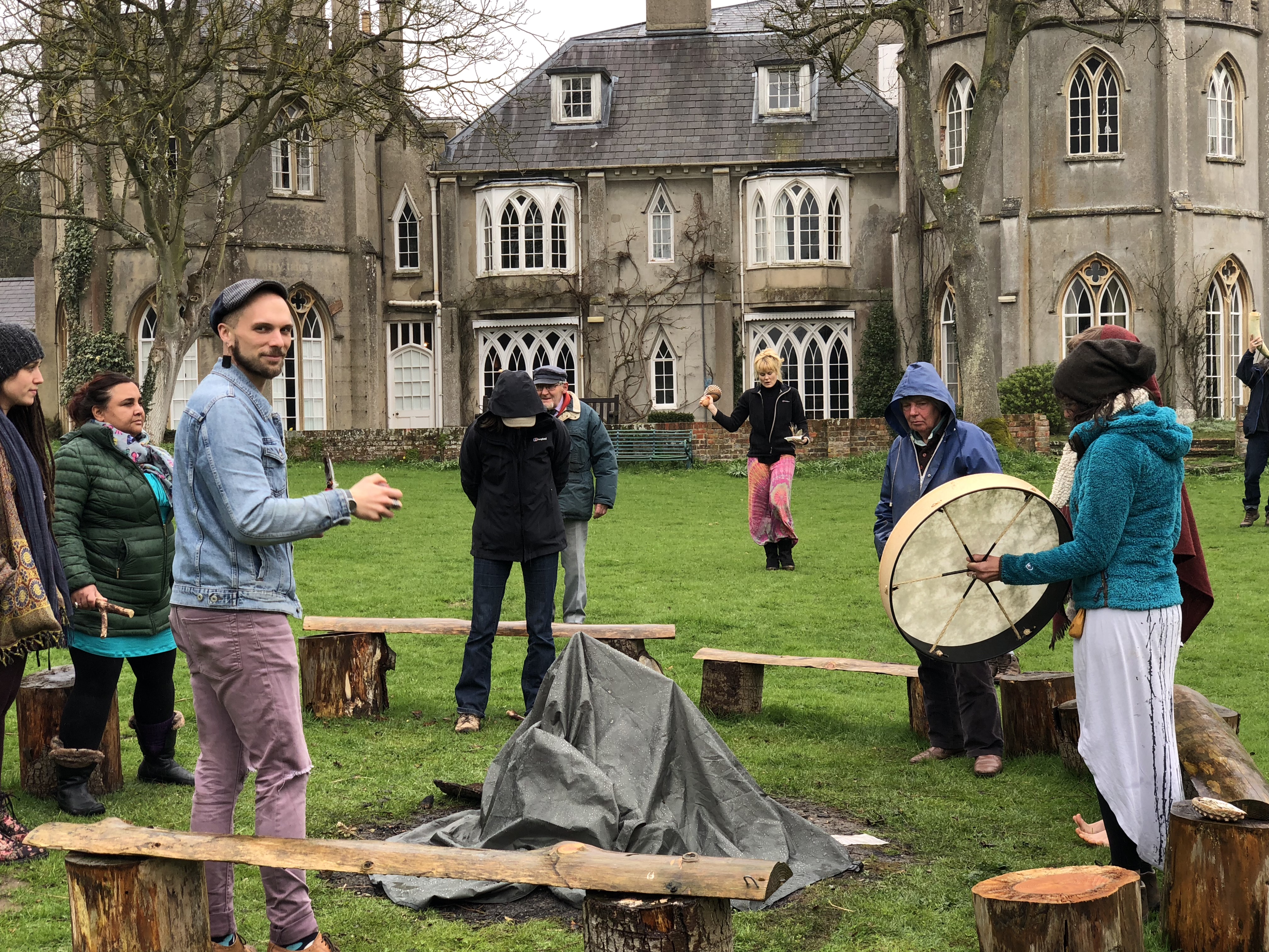 People participating in outdoor community activity at Braziers Park.