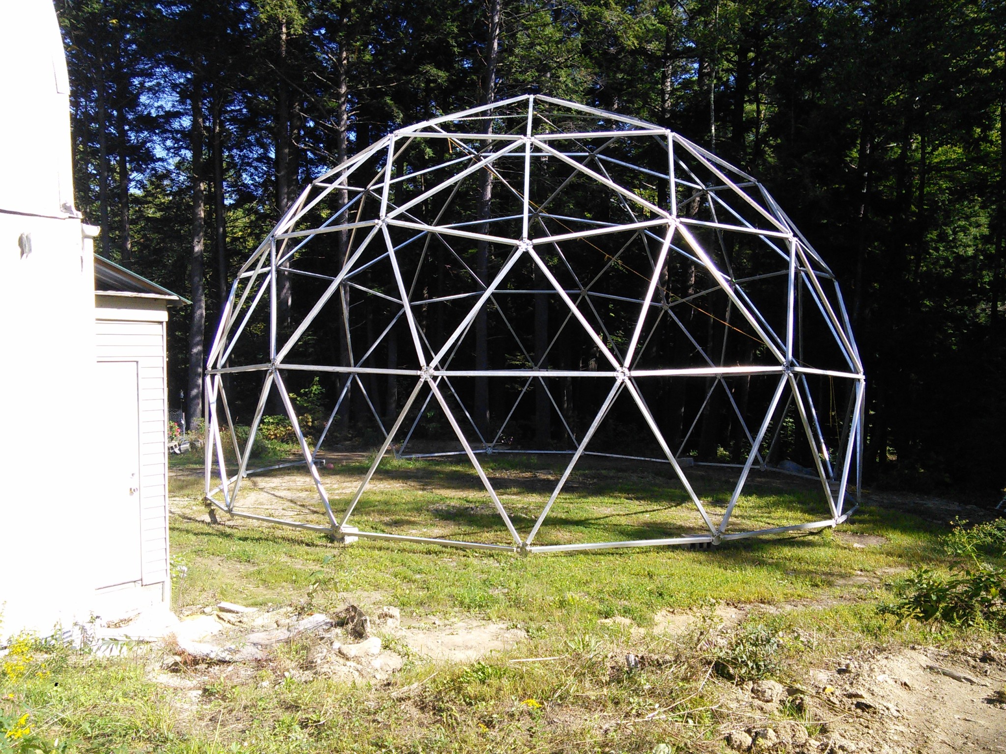 Large geodesic dome structure on Sunburst Farm property.