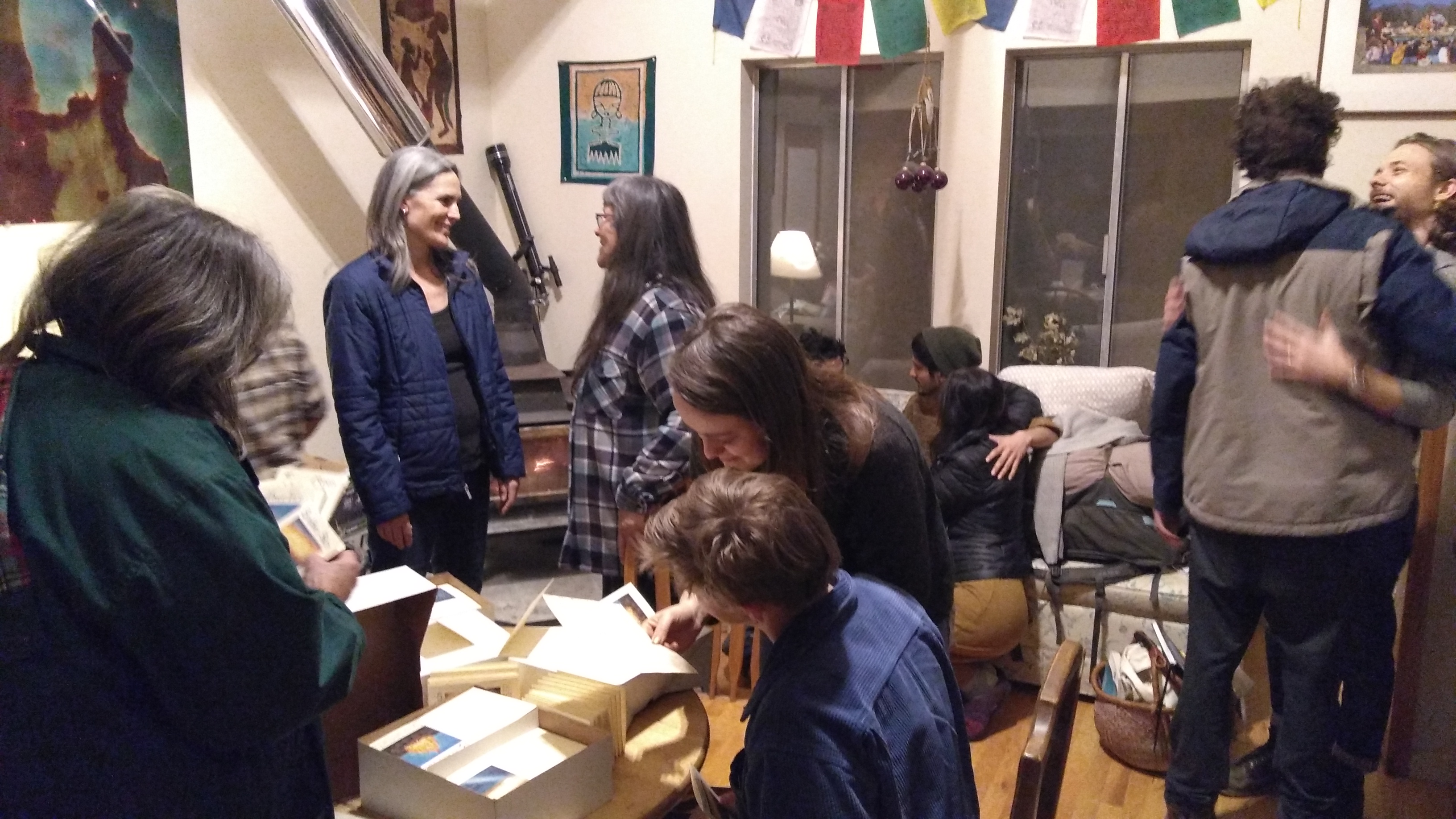 People socializing and engaging in a community event indoors.
