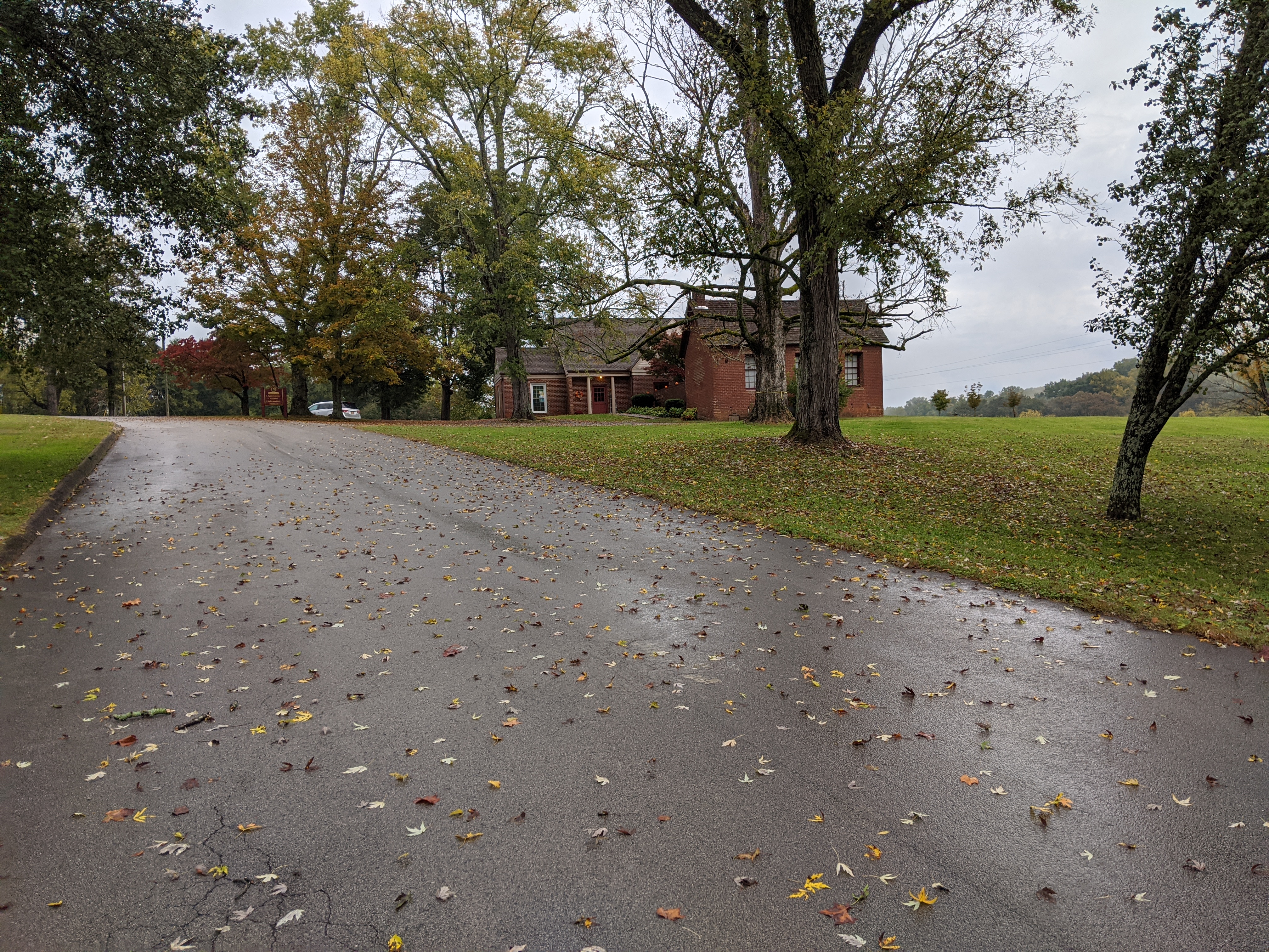 Scenic view of community buildings surrounded by trees in fall.