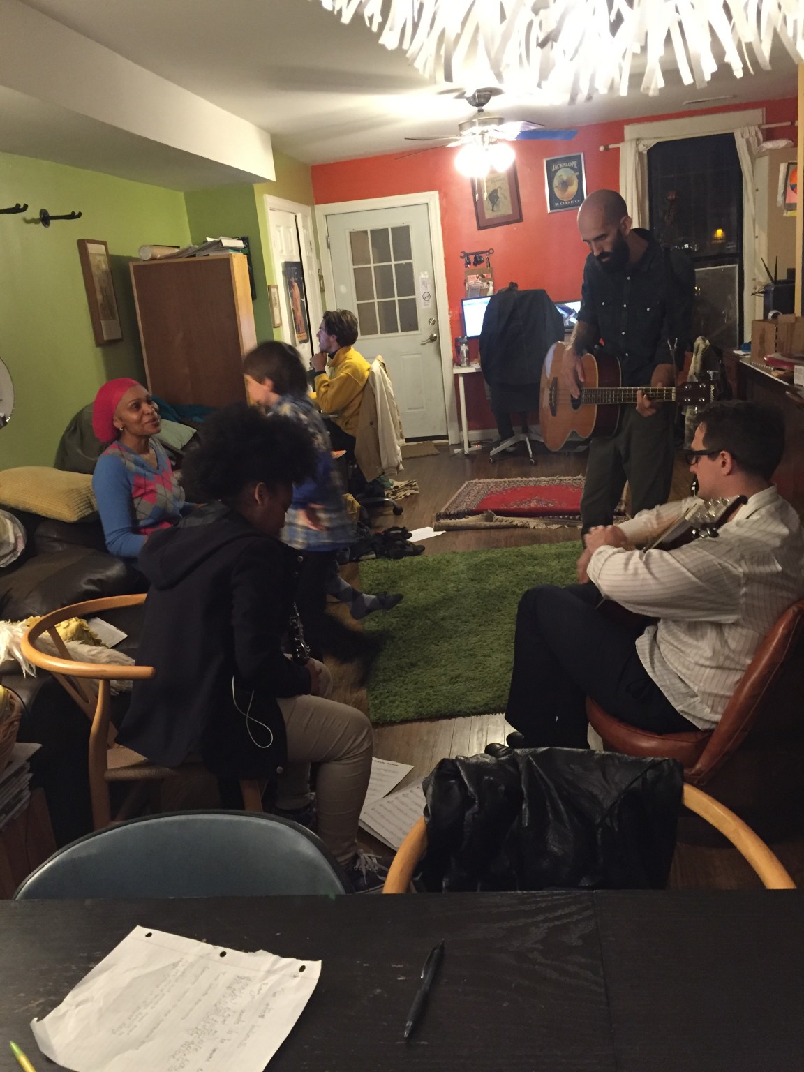 People enjoying live music at Foundation for Intentional Community event.