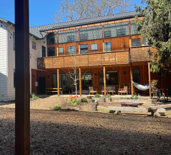 Contemporary wooden community building at The Grove Intentional Living Community.