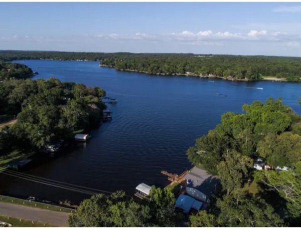 Scenic view of Callender Lake surrounded by lush greenery and trees.