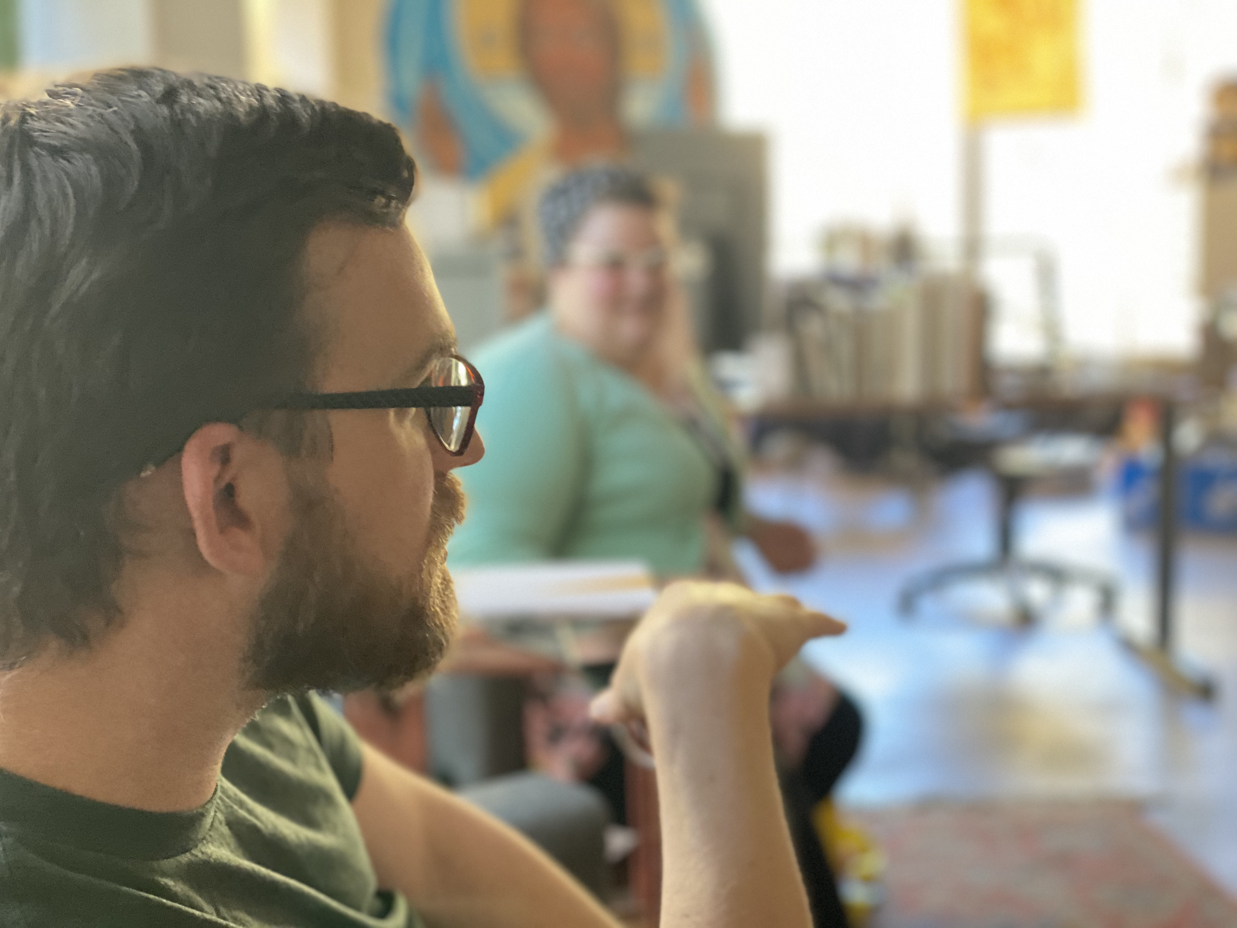 People engaged in a community discussion at Jesus People Chicago.