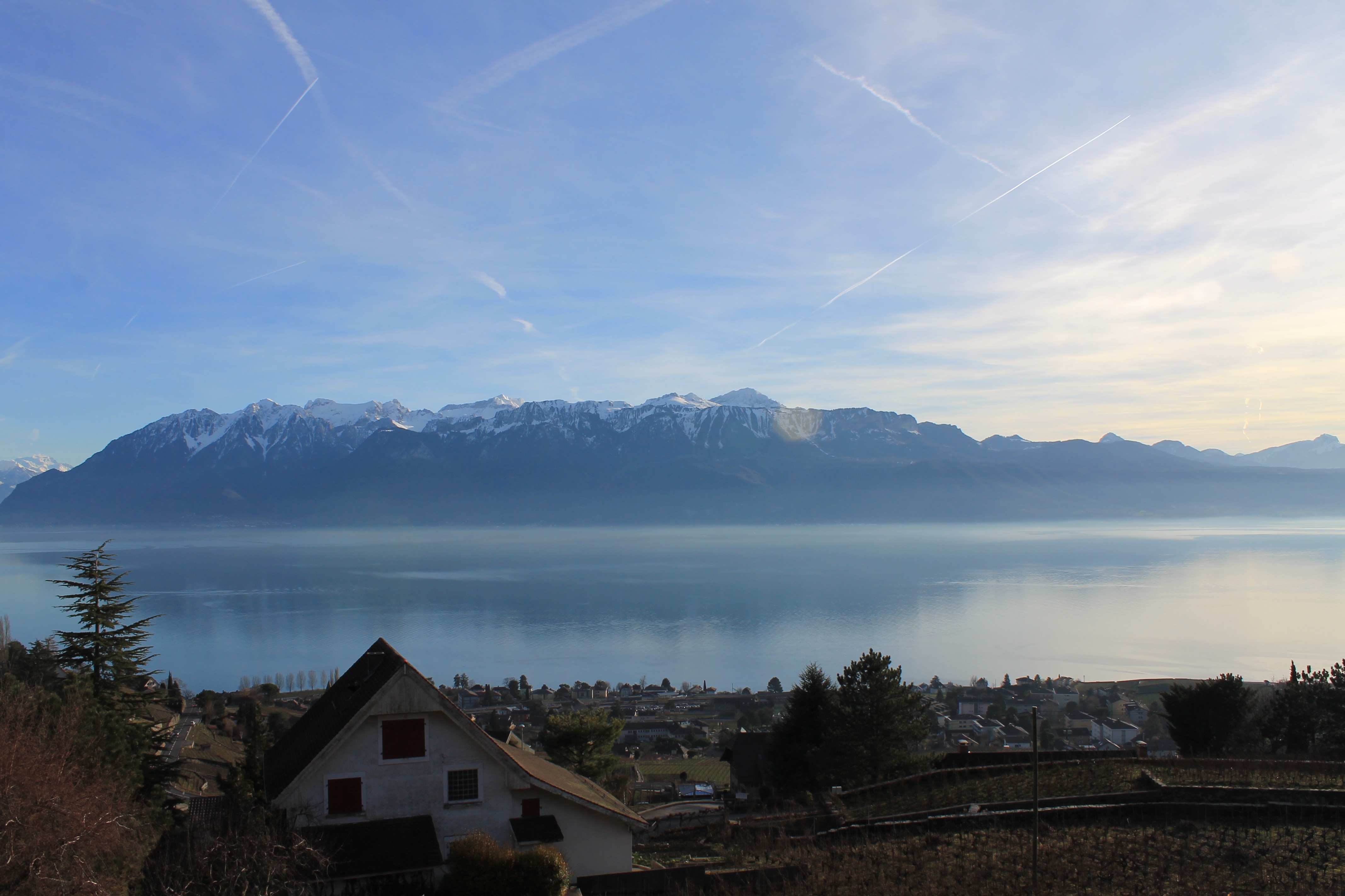 Beautiful landscape of Lake Geneva with snow-capped Alps in the background.