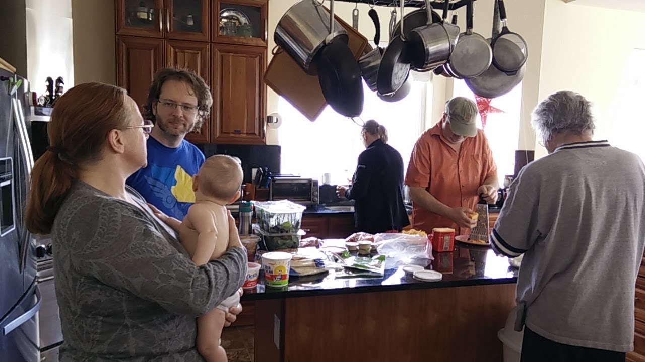 People enjoying a community meal at the Foundation for Intentional Community.