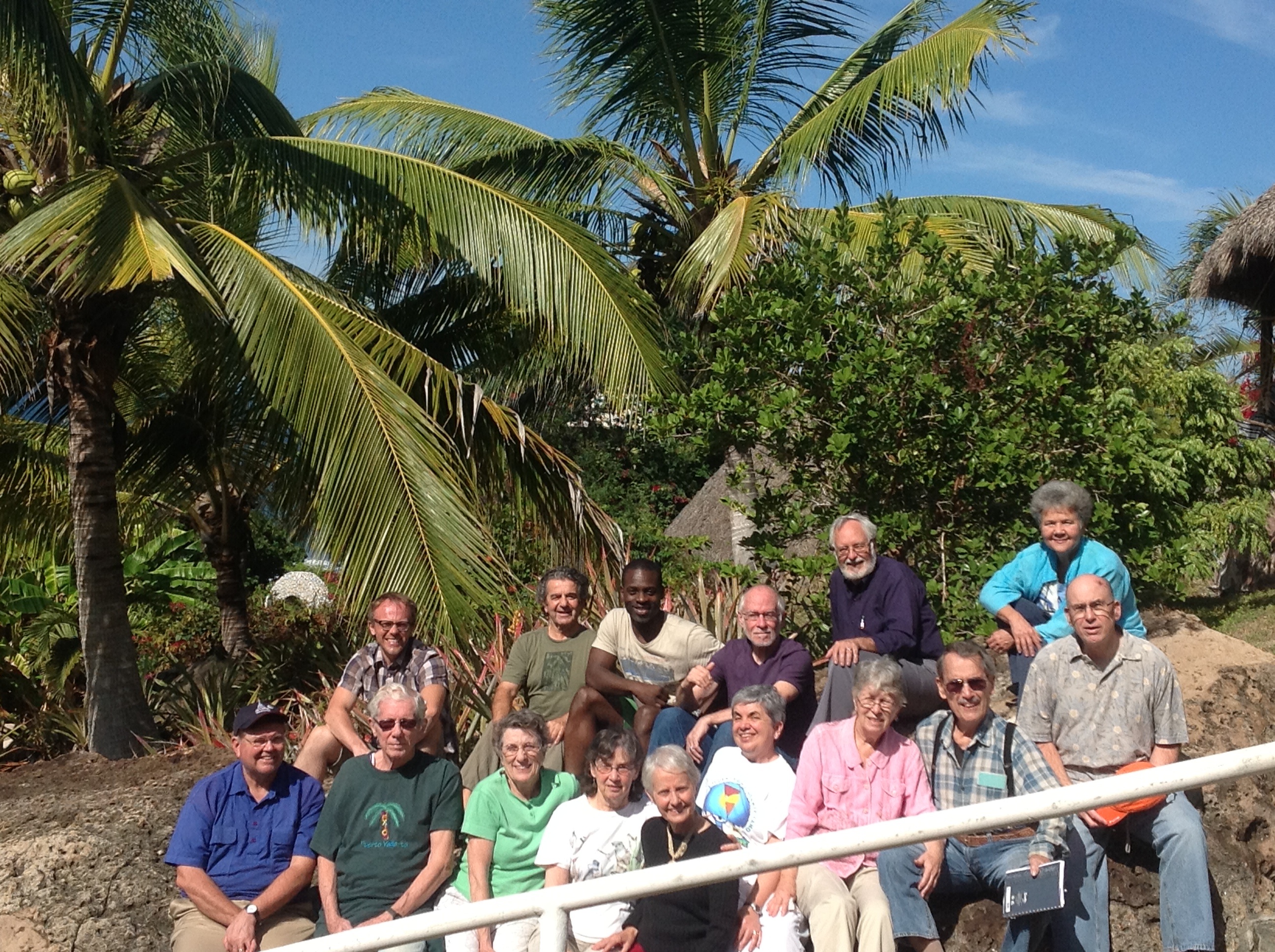 Group of diverse people gathered outdoors at Litibu EcoVillage.