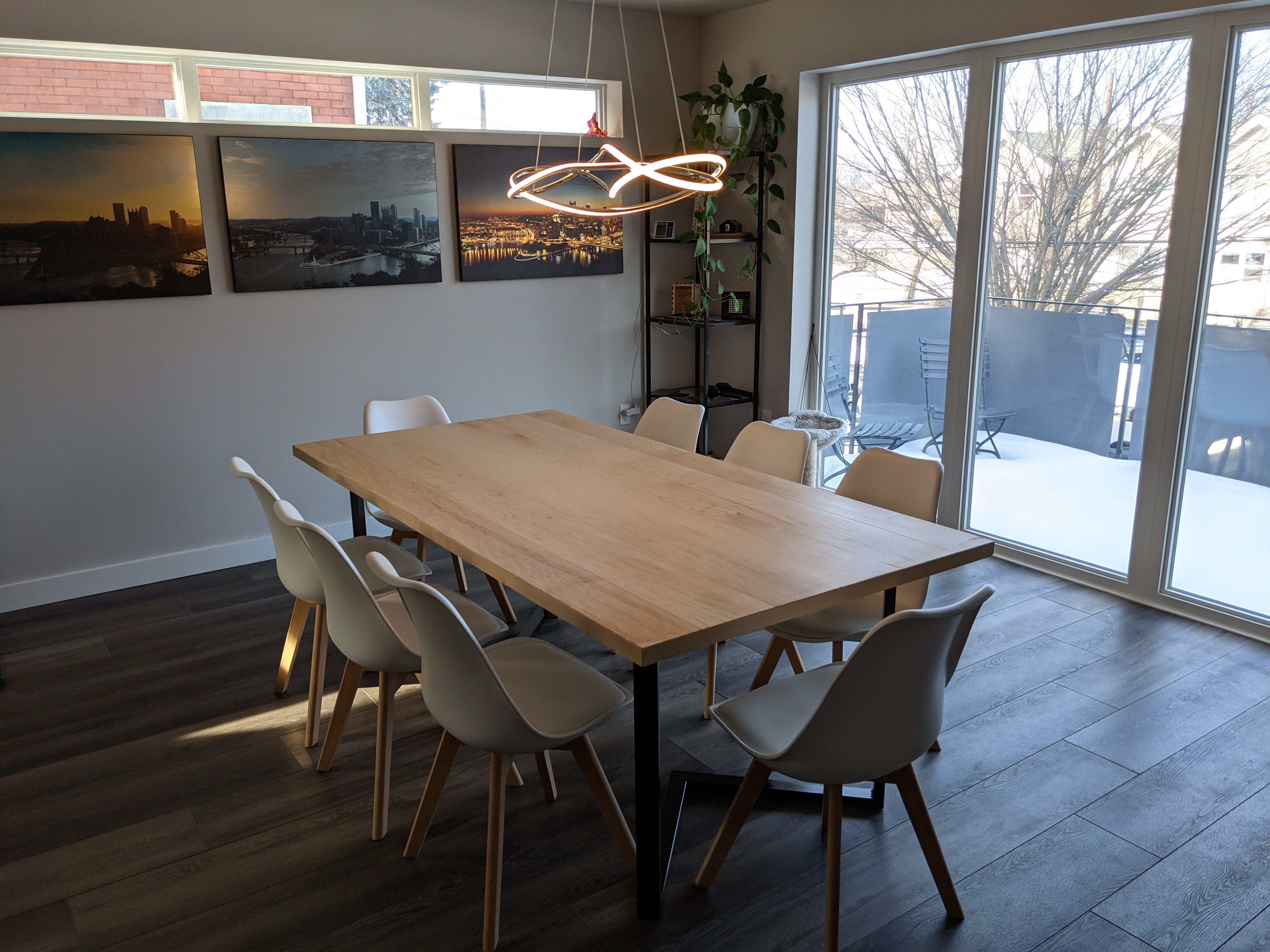 Contemporary conference room with large windows and cityscape view.