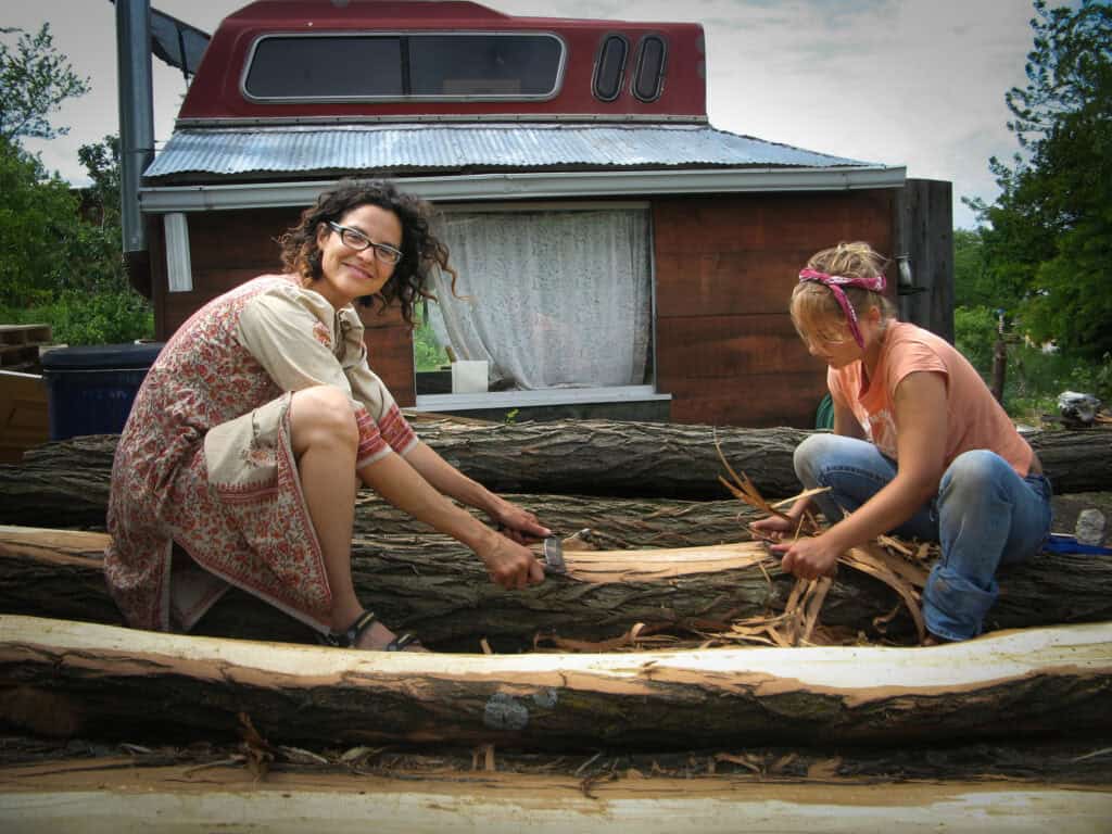 Two women working on a community project at Dancing Rabbit Ecovillage.