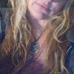 Portrait of a woman with long, wavy blonde hair for community-focused SEO.