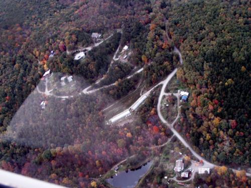 Aerial view of Julian Woods Community surrounded by colorful autumn forest.