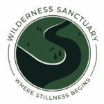 Wilderness Sanctuary logo with a winding river and trees in a circle.