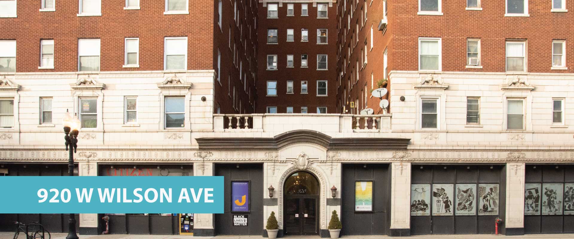 Historic brick building with community center signage at 920 W Wilson Ave.