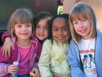 Group of happy children at Pleasant Hill Cohousing community.