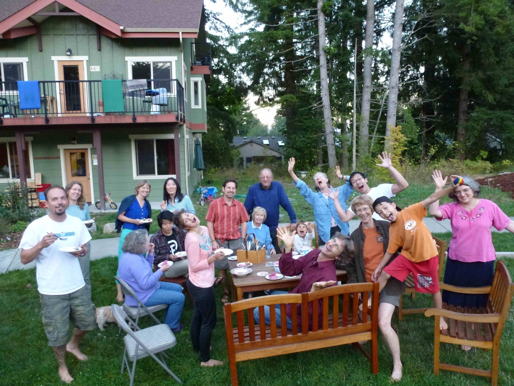 Group of people enjoying outdoor gathering at Woodard Lane Cohousing community.
