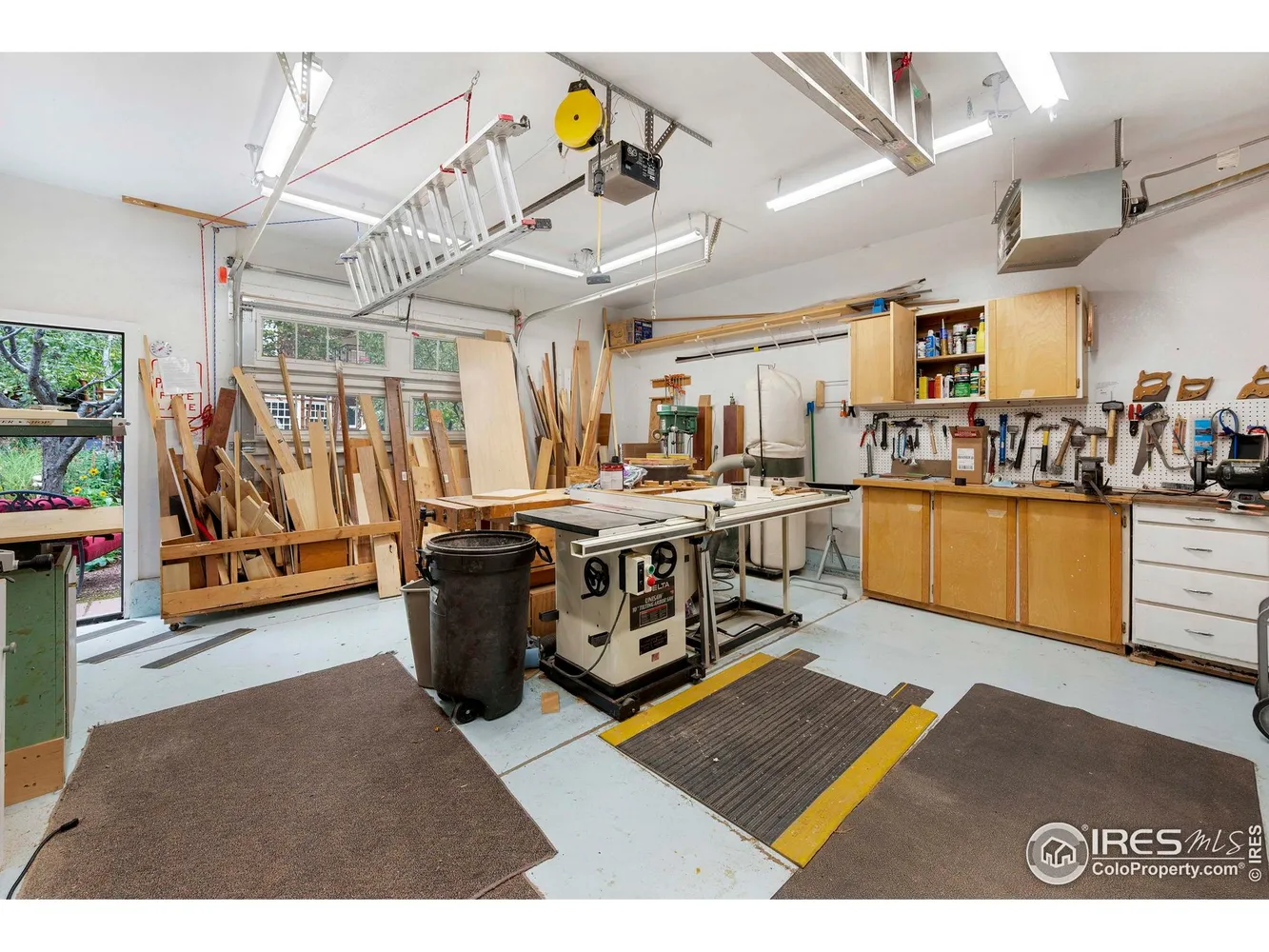 Well-equipped woodworking workshop with tools and workbenches at Silver Sage Village.