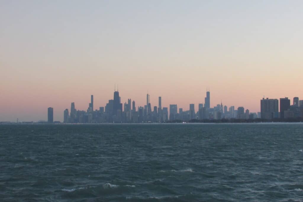 City skyline of Chicago viewed from Lake Michigan at sunset.