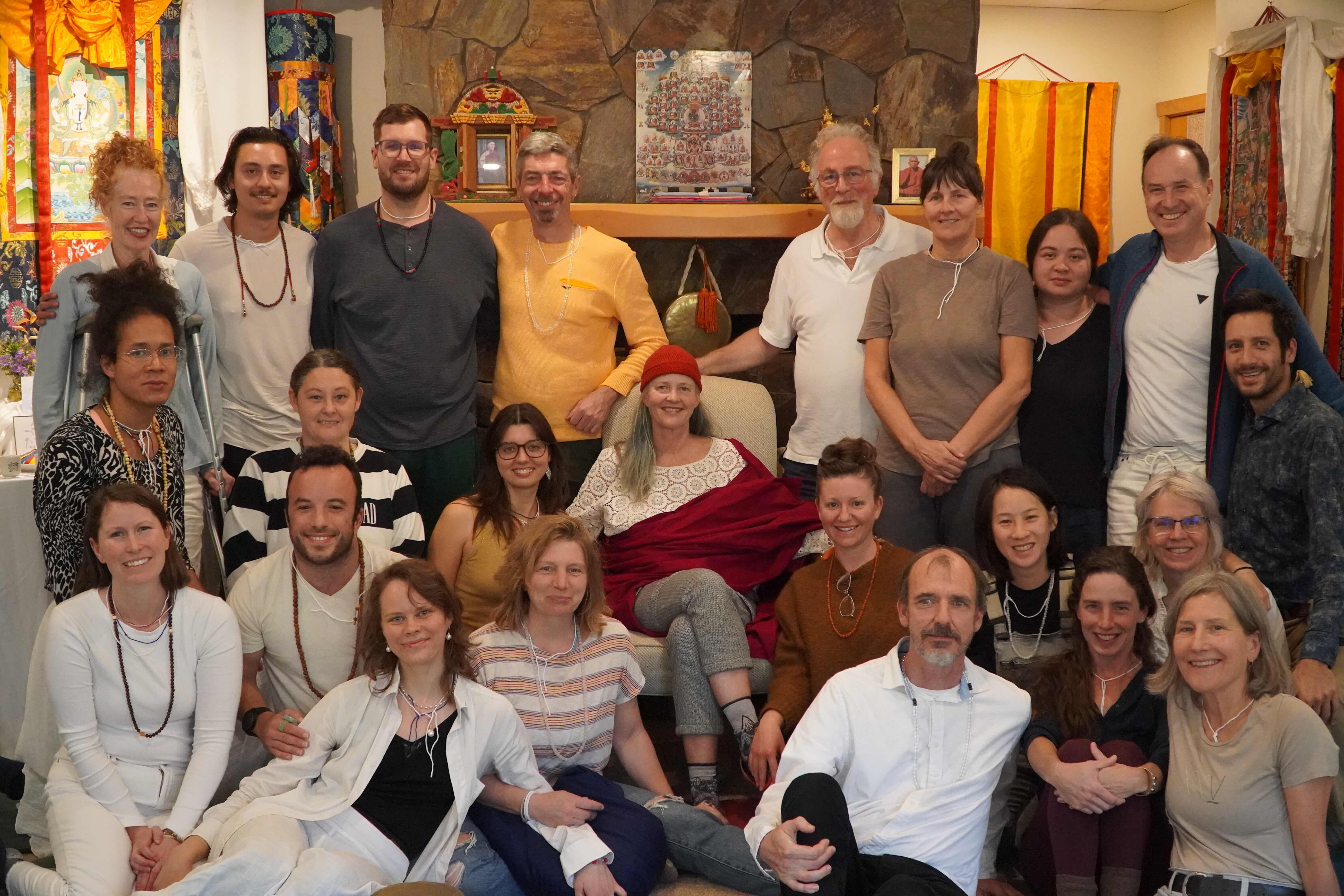 Group of diverse people gathered indoors at Foundation for Intentional Community.