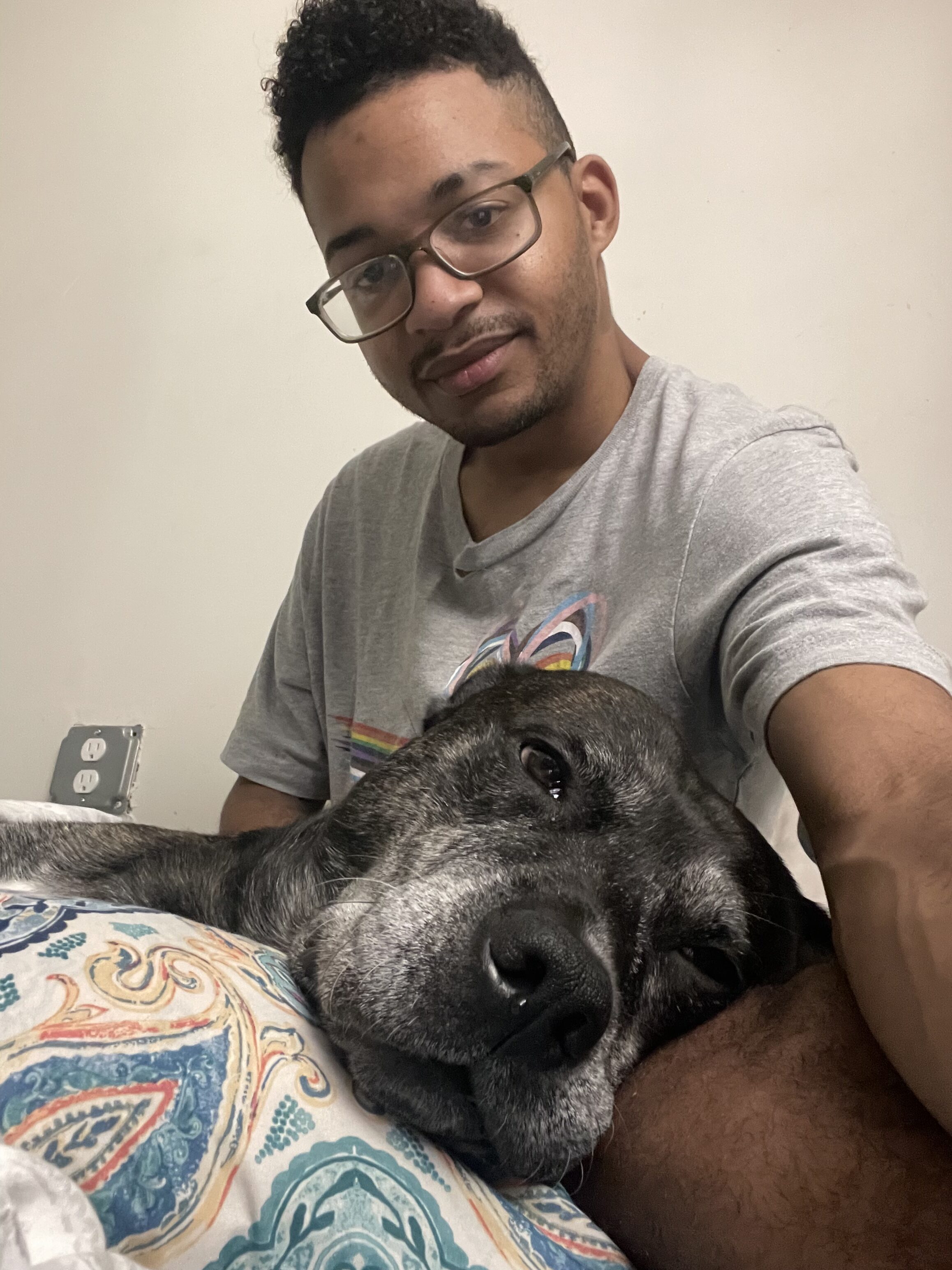 Person with dog in a cozy indoor setting for community and pet companionship.